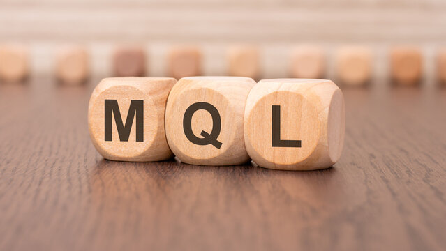 word mql - marketing qualified lead - is written on wooden cubes