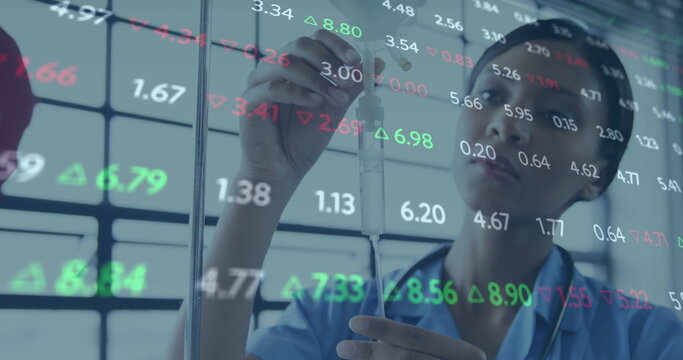 Image of changing numbers over biracial female nurse checking iv drip in hospital ward