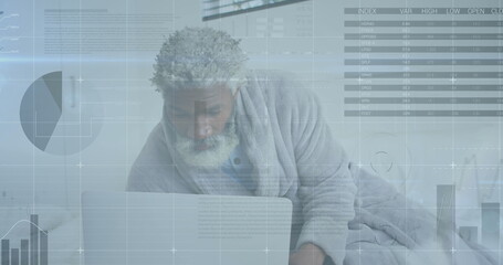 Image of statistical data processing against african american senior man using laptop at home