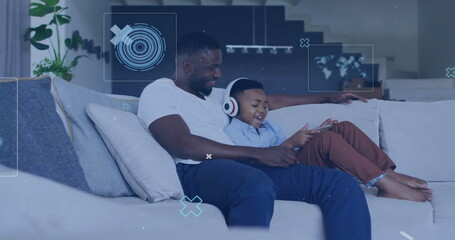 Image of data processing over african american father and son using tablet