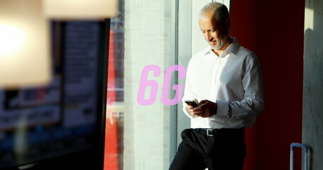 Image of 6g text over caucasian businessman using smartphone