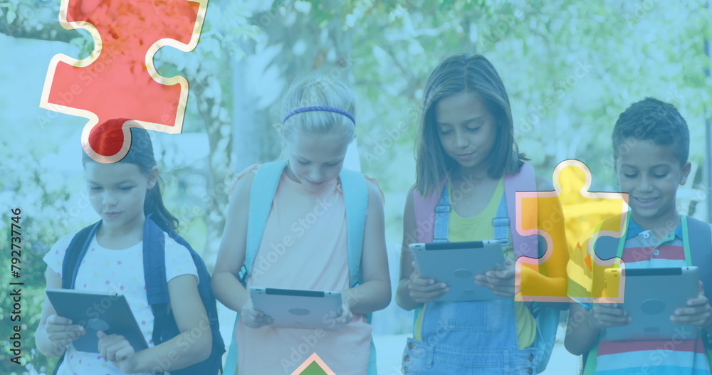 Poster Image of colourful puzzle pieces over school children using tablets