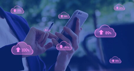 Image of pink cloud symbols uploading data over caucasian businesswoman using smartphone - obrazy, fototapety, plakaty