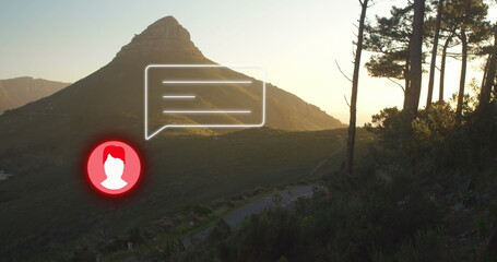 Image of neon profile and message icon against landscape with mountains and forest - Powered by Adobe