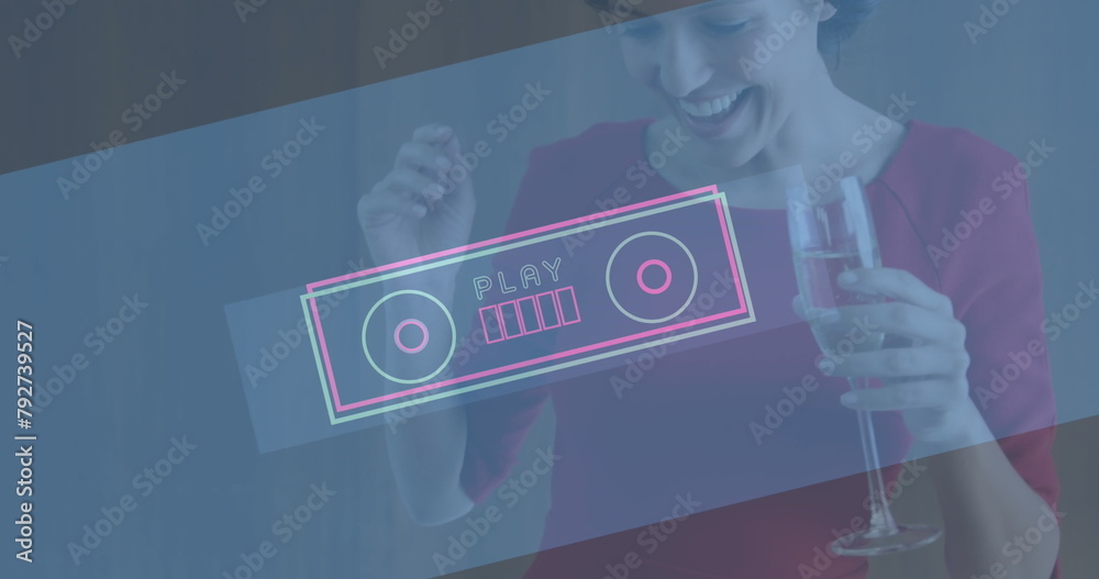 Wall mural Image of neon play text in retro tape recorder over smiling woman dancing