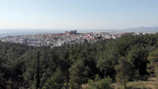 Aerial drone view of byzantine  Heptapyrgion of Thessaloniki yedikule fortress from nearby forest sunny day blue sky