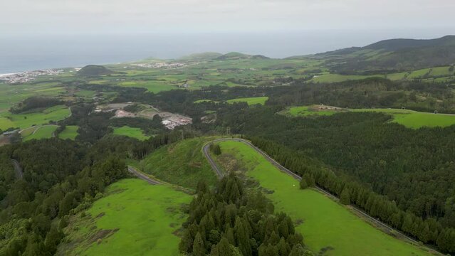 Aerial perspective unveils the panoramic beauty and landscapes of the Azores region in Portugal, encapsulating the concept of exploration and discovery.