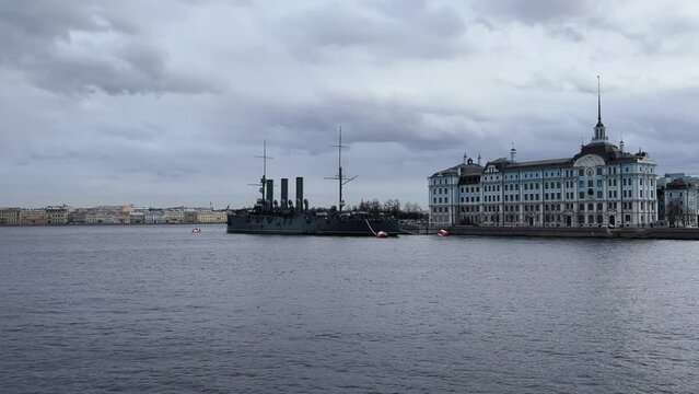 St. PETERSBURG, RUSSIA - April 20, 2024: The Aurora Cruiser Museum on the Neva River on a 20th-century warship. View of the cruiser Aurora, a historical warship, now a war memorial museum. 4К