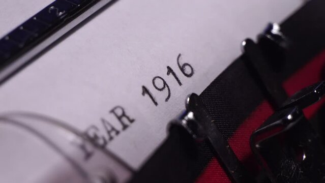 Year 1916, Typing on Blank White Paper in Vintage Typewriter, Macro Close Up