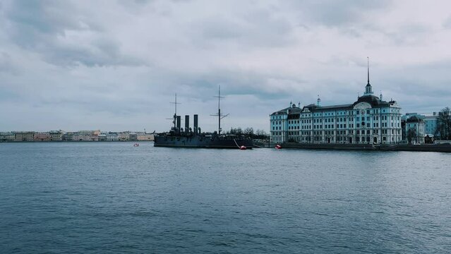 St. PETERSBURG, RUSSIA - April 20, 2024: The Aurora Cruiser Museum on the Neva River on a 20th-century warship. View of the cruiser Aurora, a historical warship, now a war memorial museum. 4К