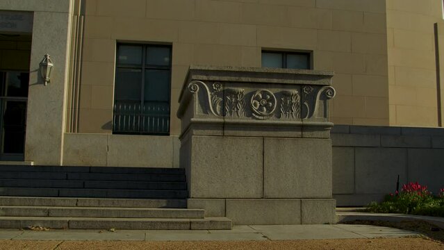 An entrance of the Federal Trade Commission panning to the Man Controlling Trade statue in spring in Washington