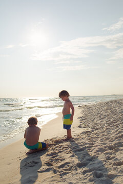 Young boys playing on a sunny beach