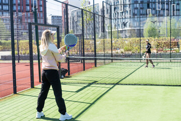 One women playing Paddle tennis - 792762944