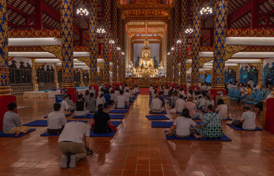 Local people and Buddhist monks celebrating the Magha Puja full moon festival at the Wat Suan Dok Lanna temple in Chiang Mai,Thailand