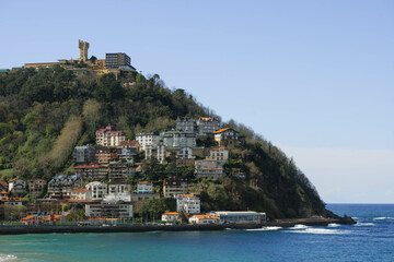 view from the top of a cliff on sunny day of blue ocean in northern spain biscay bay