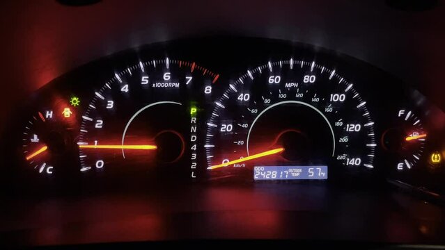 Car instrument panel with lights on and flashing with more than 240,000 miles