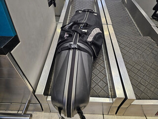 Black Suitcase on Escalator