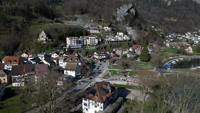 Drone clip showing traditional white buildings in Swiss alpine village