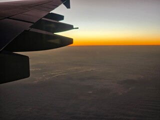 The Wing of an Airplane at Sunset