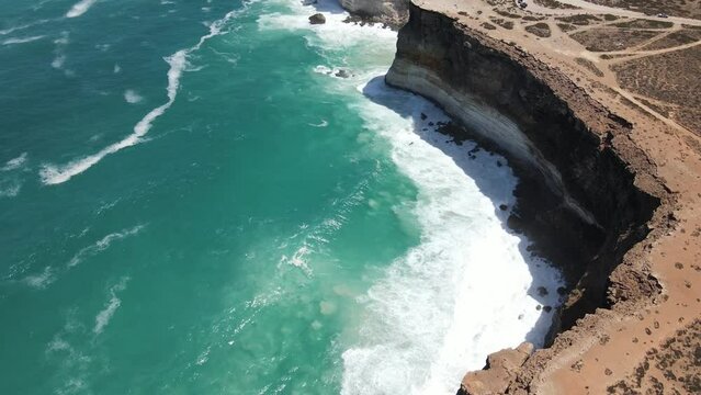 Drone aerial slow pan over the Great Australian Bight with waves