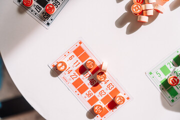 Lotto board game with red barrels and colorful cards.
