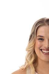 Plus-size Caucasian female with blonde hair smiles on white background, copy space
