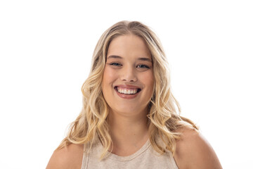 Caucasian young female plus size model smiles on white background, copy space - 792788590