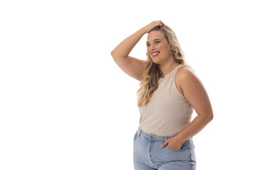 A young Caucasian plus-size model stands on white background, copy space