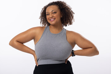 A biracial young female plus size model poses on white background - Powered by Adobe