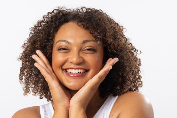 A biracial young female plus size model with curly brown hair on white background - Powered by Adobe