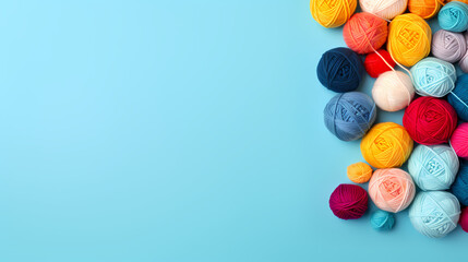 Fototapeta na wymiar Colorful yarn balls on blue background