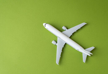 Airline plane on green background. Airline. World communication and commercial flights. Arrival and departure. Passenger transportation. Ecology and success concept. Business and tourism.