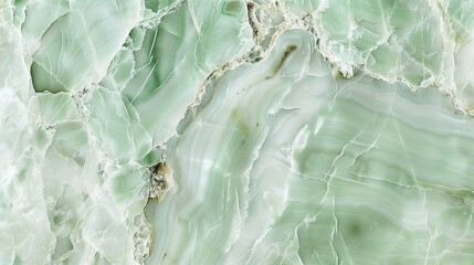 Pale mint green marble texture, with soft white and green veins, perfect for a light and airy background