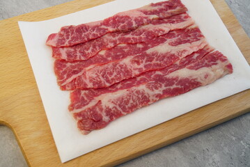 large beef cubes medium squares on wood