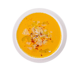 Homemade creamy pumpkin soup with toppings
