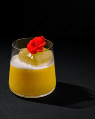 Elegant cocktail with edible flower garnish