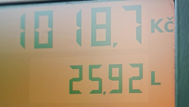 Gas station fuel meter counter price in Czech crown. Close up while refueling a car in Czech republic. Increasing petrol costs in Europe
