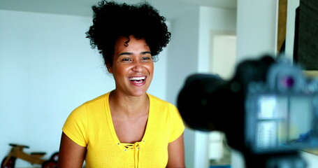 One young black woman speaking in front of camera giving testimony for online channel. 20s female...