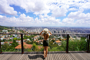 Tourist woman enjoying cityscape of Belo Horizonte, Minas Gerais, Brazil - obrazy, fototapety, plakaty