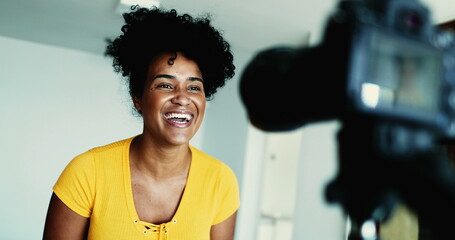 One Dynamic 20s Black Woman Recording Testimonial Video, Engaging Online Audience as a New Media...