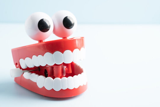 Tooth funny toy denture red color jaw and eye.