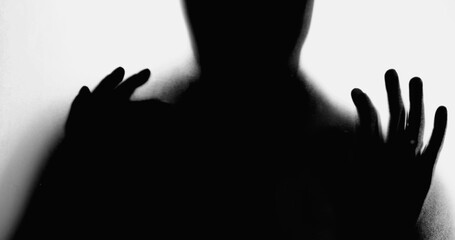 Silhouette of Person Leaning on Foggy Glass, Hands Pressed in Despair, Overcome by Depression,...