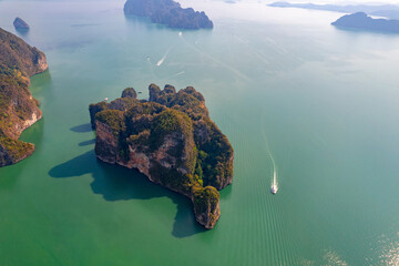 Aerial view Tourist speed boat in national park Phang Nga bay and Hong island with jungle, trip in Thailand. Concept nature beautiful landscape of Asia travel