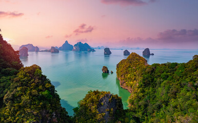 Travel trip on Thailand concept. Beautiful sunset landscape Hong tropical island and Phang Nga bay in turquoise sea, aerial view