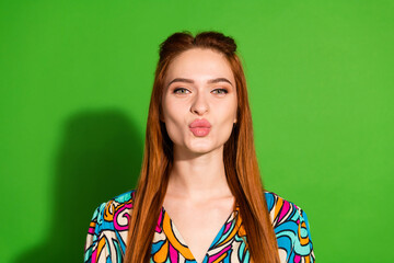 Photo portrait of attractive young woman kiss pouted lips dressed stylish retro clothes isolated on green color background - obrazy, fototapety, plakaty