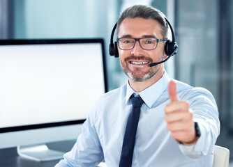 Thumbs up, portrait and man call center consultant in office for crm online consultation with...