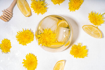 Dandelions cold iced tea or lemonade. Plant herbal flower drink with dandelions flowers and roots,...