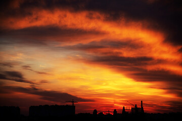 Background of a beautiful bright orange sunset with cirrus clouds