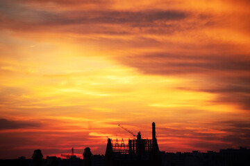 Fototapeta na wymiar Background of a beautiful bright orange sunset with cirrus clouds