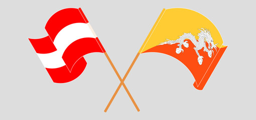 Crossed and waving flags of Austria and Bhutan